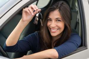Woman Sitting In Car With Key